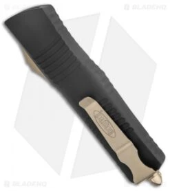 Microtech Combat Troodon D/E OTF Knife Black (3.8" Bronze Full Serr) 142-15 8 Microtech Combat Troodon D/E OTF Knife Black (3.8" Bronze Full Serr) 142-15 -Microtech Microtech Combat Troodon DE OTF Black Bronze Full Serr BHQ 135085 jr side