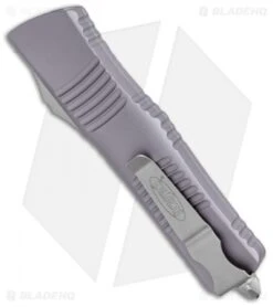 Microtech Combat Troodon T/E Automatic OTF Knife Gray (3.8" Stonewash Serr) -Microtech Microtech Combat Troodon TE Auto Gray SW Serr 144 11GY BHQ 98184 jr side