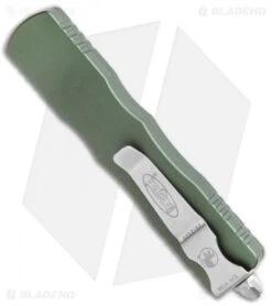 Microtech Dirac Dagger OTF Automatic Knife OD Green (2.88" Stonewash Full Serr) -Microtech Microtech Dirac Dagger OTF Auto OD Green SW Full Serr BHQ 111330 jr side