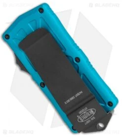 Microtech Exocet Dagger CA Legal OTF Automatic Knife Teal (1.9" Black Serr) -Microtech Microtech Exocet Dagger CA Legal OTF Auto Turquoise Black Serr 157 2TQ BHQ 115028 jr side