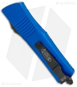 Microtech Blue Troodon D/E OTF Automatic Knife (3" Black Full Serr) 138-3BL 8 Microtech Blue Troodon D/E OTF Automatic Knife (3" Black Full Serr) 138-3BL -Microtech Microtech Troodon DE OTF Blue Black Full Serr 138 3BL BHQ 12601 jr side