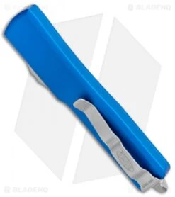 Microtech UTX-70 D/A OTF D/E Automatic Knife Blue (2.4" Stonewash Serr) -Microtech Microtech UTX 70 DA OTF DE Auto Blue SW Serr 147 11BL BHQ 98266 jr side