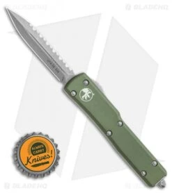 Microtech UTX-70 D/A OTF Automatic Knife OD Green (Apocalyptic Full Serr) -Microtech Microtech UTX 70 DA OTF DE Automatic Knife OD Green Apocalyptic Full Serr 147 12APOD BHQ 115741 LS Bottlecap