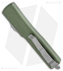 Microtech UTX-70 D/A OTF Automatic Knife OD Green (Apocalyptic Full Serr) -Microtech Microtech UTX 70 DA OTF DE Automatic Knife OD Green Apocalyptic Full Serr 147 12APOD BHQ 115741 LS Side
