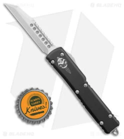 Microtech UTX-70 Warhound Signature Series OTF Automatic Knife (2.4" SW) 419W10S -Microtech Microtech UTX 70 Warhound Signature Series Black SW Wharncliffe BHQ 177625 jr bottlecap