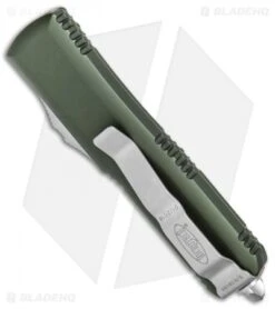 Microtech UTX-85 D/E OTF Automatic Knife OD Green (3.125" Satin Serr) 232-5OD -Microtech Microtech UTX 85 DE OTF OD Green Satin Serr 232 5 OD BHQ 80386 jr side