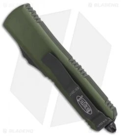 Microtech UTX-85 S/E OTF Automatic Knife OD Green (3.125" Black Serr) 231-2OD 8 Microtech UTX-85 S/E OTF Automatic Knife OD Green (3.125" Black Serr) 231-2OD -Microtech Microtech UTX 85 SE OD Green black serr 231 2OD BHQ 69047 er side