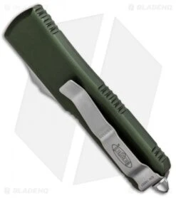 Microtech UTX-85 S/E OTF Automatic Knife OD Green (3.125" Satin Serr) 231-5 OD 8 Microtech UTX-85 S/E OTF Automatic Knife OD Green (3.125" Satin Serr) 231-5 OD -Microtech Microtech UTX 85 SE OTF OD Green Satin Serr 231 5 BHQ 89935 jr side